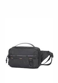 Borsa a vita AOKING nera realizzata in tessuto testurizzato. Presenta tasche con zip, una fibbia laterale e cuciture a contrasto. Ha una forma compatta e rettangolare.