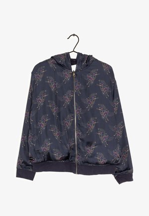 Sweat à capuche zippé bleu marine avec poignets et ourlet élastiques, décoré d'un motif d'oiseaux en vol avec des accents floraux.