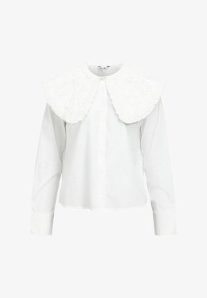 Valkoinen paita, jossa on suuri, teksturoitu ja röyhelöinen kaulus. Pitkät hihat ja edessä napitus. Yksinkertainen malli ja pehmeä puuvillamateriaali.