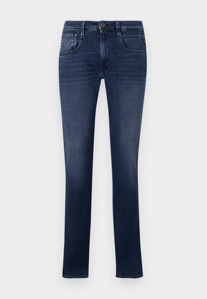 Dark blue denim jeans with a straight cut, featuring five pockets, subtle stitching, and a single button closure at the waist.