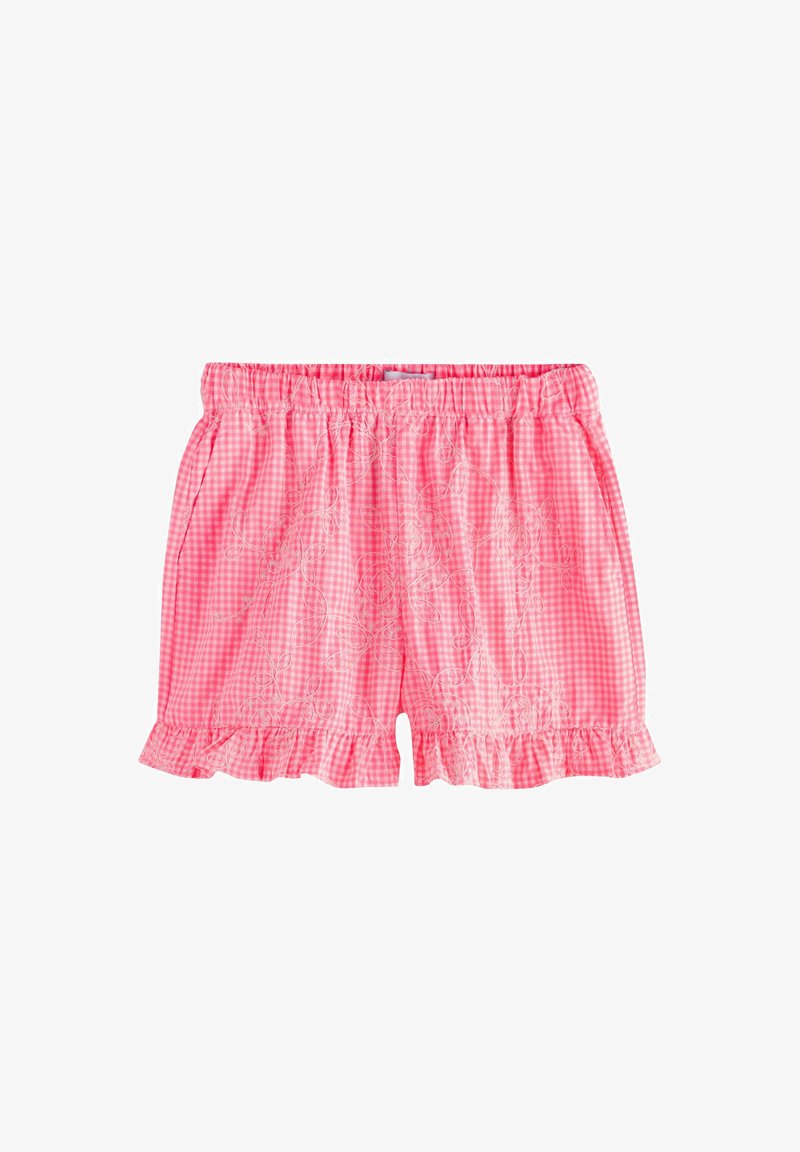 Shorts en vichy rose avec taille élastique, ourlets à volants, poches latérales et broderie florale blanche subtile sur le tissu.