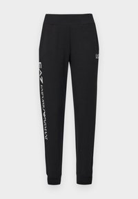 Svarta sweatpants i blandning av bomull, med en tapered passform, elastisk midja och vit logotext längs vänster ben. Mjuk textur.