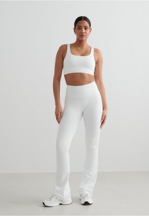 RIBBED SEAMLESS - Medium support sports bra - white