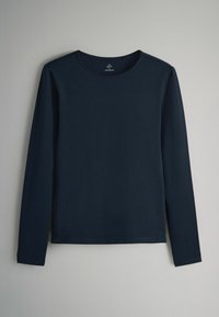 Langärmliges, marineblaues Hemd aus weichem Stoff. Rundhalsausschnitt mit minimalen Nähedetails, gerader Saum und ohne sichtbare Muster oder Grafiken.