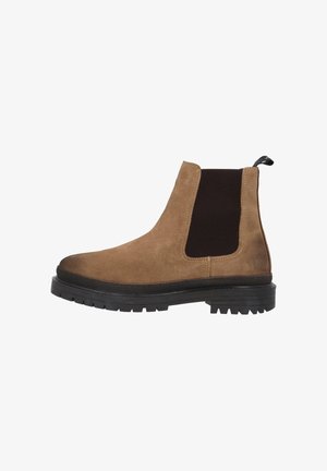 Brown suede Chelsea boot with black elastic side panels and a pull tab, featuring a rugged black rubber sole and textured finish.