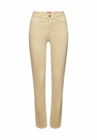 Jeans de un beige claro con un corte slim, que cuentan con un cierre de botón clásico, diseño de cinco bolsillos y una textura de denim suave.