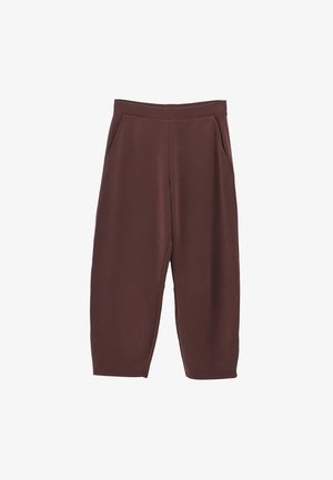 Bruine, wijde broek van zacht, textuurstof. Voorzien van zijzakken en een gladde, elastische tailleband. Verkorte lengte.