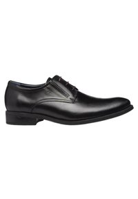 Zapatos de vestir de cuero negro con cordones, acabado suave, punta redondeada y cordones de color contrastante. Presenta un tacón bajo y apilado, con un diseño elegante.