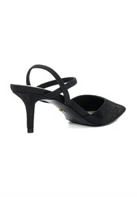 Black slingback heel with a textured fabric upper, pointed toe, and slender high heel. Features crisscross straps and a logo accent.