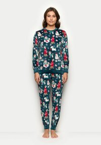 Dvoukusová pyžamová souprava v teal barv�ě. Obsahuje hravé zimní ilustrace psů v slavnostním oblečení. Dlouhé rukávy a elastické manžety.