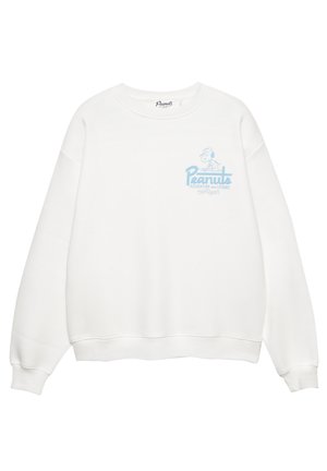 Sweat-shirt blanc à col rond, épaules tombantes et poignets côtelés. Présente un graphisme de dessin animé bleu clair et un texte sur le devant.