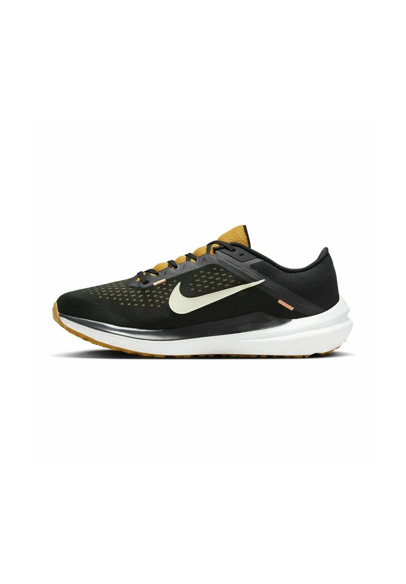 Black and mustard running shoe with white sole, light green Nike swoosh, mesh upper, and lace-up closure.