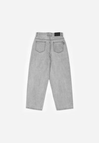 Gray denim jeans with a loose fit, featuring two back pockets and a leather label at the waistband. Soft texture and casual design.