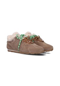 Suede sneakers in light brown with fuzzy white lining, patterned green and white laces, and a rubber sole with subtle perforations.