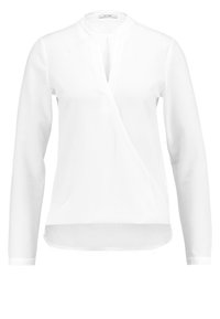 Bílá blůza s dlouhými rukávy, výstřihem do V a předním rozparkem. Vyrobena z hladkého materiálu, s rovním lemem a minimalistickým designem.