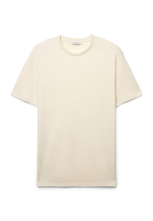 T-shirt a maniche corte color crema realizzata in cotone liscio, con scollo rotondo e design semplice e lineare senza decorazioni.