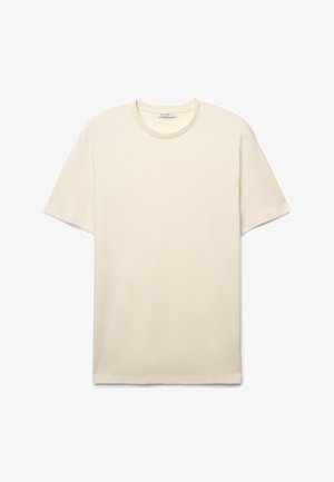 T-shirt a maniche corte color crema realizzata in cotone liscio, con scollo rotondo e design semplice e lineare senza decorazioni.