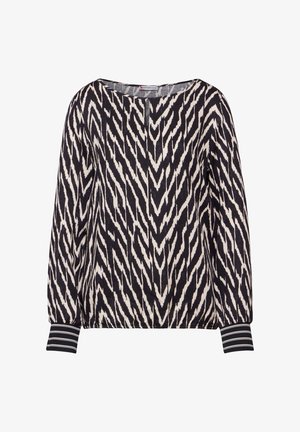 Bluzka w czarno-białym kolorze z nadrukiem w zygzaki, okrągły dekolt, luźny krój i paskowane mankiety. Wykonana z miękkiego materiału.