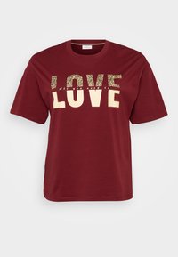 Burgundy t-shirt with short sleeves featuring "LOVE" in gold and leopard print text. Simple crew neck design, soft cotton material.