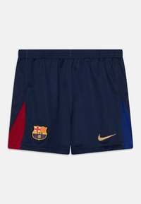 Pantaloni da calcio navy realizzati in tessuto traspirante, con un pannello laterale rosso e blu. Include un logo Nike dorato e un emblema del club di Barcellona.