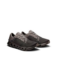Black and grey athletic shoes with a textured mesh upper, secured laces, and a cushioned sole featuring unique segmented sections.