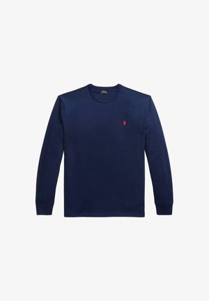 Camicia di cotone a maniche lunghe di colore blu navy, con scollo rotondo, polsini a costine e un piccolo logo rosso del polo sul lato sinistro del petto. Tessuto liscio.