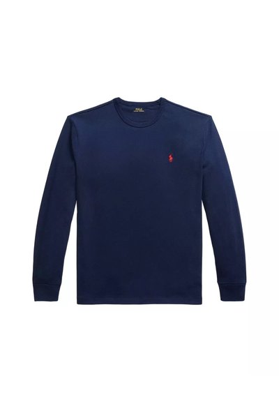 Camicia di cotone a maniche lunghe di colore blu navy, con scollo rotondo, polsini a costine e un piccolo logo rosso del polo sul lato sinistro del petto. Tessuto liscio.