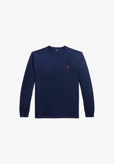 Camicia di cotone a maniche lunghe di colore blu navy, con scollo rotondo, polsini a costine e un piccolo logo rosso del polo sul lato sinistro del petto. Tessuto liscio.