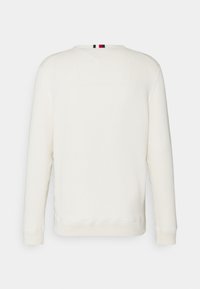 Weißes Sweatshirt, strukturiert, mit langen Ärmeln, gerippten Bündchen und rundem Ausschnitt. Auf der Rückseite befindet sich ein kleines gestreiftes Detail.