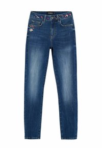 Jean en denim bleu avec une coupe droite, featuring des broderies florales sur la ceinture et un léger délavage le long des jambes.