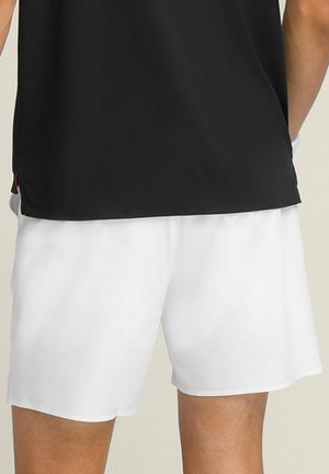 White athletic shorts with a smooth texture, featuring an elastic waistband. Paired with a black shirt for contrast.