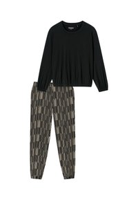 Zwarte lange mouw top met een geraffineerde zoom, gecombineerd met zwart en beige gestreepte broek met elastische tailleband. Zachte stof, ontspannen pasvorm.
