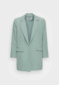 Jasnozielona marynarka z klapami, długimi rękawami, dwoma przednimi kieszeniami oraz luźnym krojem. Wykonana z gładkiego, lekkiego materiału.