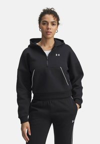 Black zip-up hoodie with a relaxed fit, featuring a front kangaroo pocket, contrasting white stitching, and an Under Armour logo on the chest.