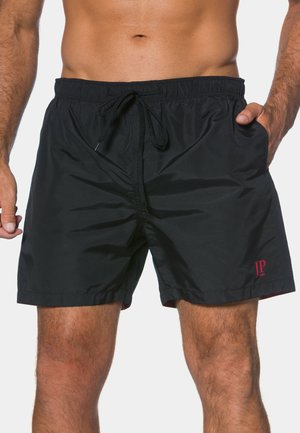 Schwarze Badeshorts mit elastischem Bund, Kordelzug und Seitentaschen. Mit kleinem roten 'JP'-Logo. Glatter, leichter Stoff.