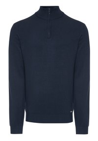 Marineblauwe gebreide pullover met een hoge kraag, voorzien van een korte rits en ribgebreide mouwen en zoom. Glad textuur met een eenvoudig ontwerp.