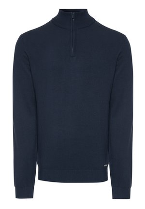 Námořnický modrý pletený svetr s vysokým límcem, který má krátký zip a žebrované manžety a lem. Hladká textura s jednoduchým designem.