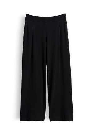 Pantalon noir à jambes larges, taille haute avec des plis sur mesure, présenté à plat sur fond blanc.