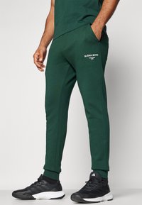 Björn Borg ESSENTIAL PANTS - Treningo apatinė dalis - pine grove