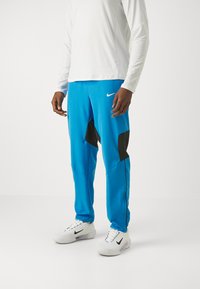 Nike Performance - PANT - Tracksuit bottoms - light photo blue/black/white Thumbnail Image 1