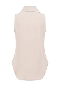 Blouse beige sans manches avec col, montrée de dos, avec une coupe ample et un tissu légèrement texturé.