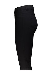 Schwarze Stretchhosen mit einem elastischen Bund, einem glatten Material, schmaler Passform und einer einzelnen Gesäßtasche. Design in cropped Länge.