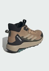 adidas Sportswear TERREX ANYLANDER MID - Turistické topánky - cardboard   blanch cargo   shadow olive