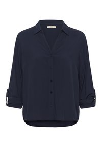 Navy blue button-up blouse, made of smooth fabric, featuring a collar, rolled sleeves, and a curved hem with a relaxed fit.