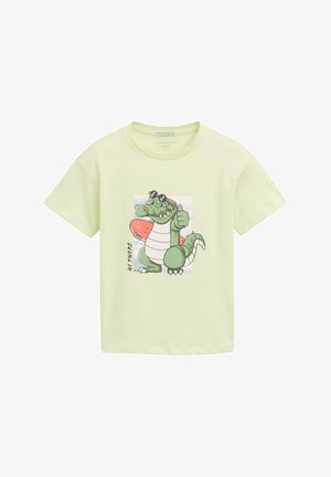 Maglietta verde chiaro in cotone con una grafica di un coccodrillo dei cartoni animati che tiene un cocomero, accompagnata dalla scritta "Ciao!". Maniche corte.