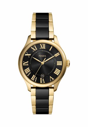 Gold and black Fossil wristwatch with Roman numerals, three hands, and a date window at six o'clock, featuring a two-tone metal bracelet.