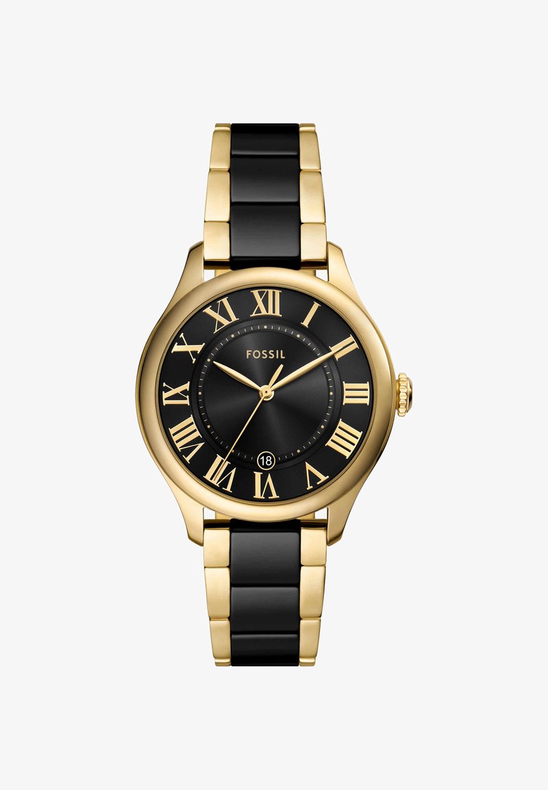 Montre Fossil dorée et noire avec chiffres romains, trois aiguilles et une fenêtre de date à six heures, avec un bracelet métallique bicolore.