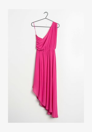 Bright pink asymmetrical dress with one thin strap and one draped shoulder, hanging on a black hanger against a white wall.
