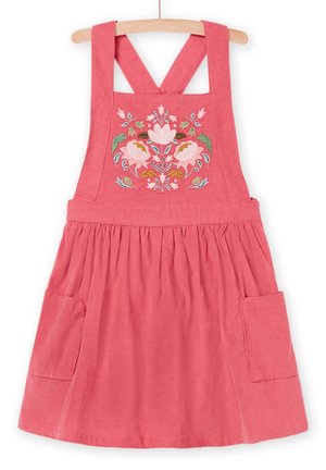 Koraalkleurige katoenen jurk met kruisbandjes aan de achterkant, geborduurd bloemmotief op de borst en twee zijzakken. Zachte textuur, uitlopende rok.