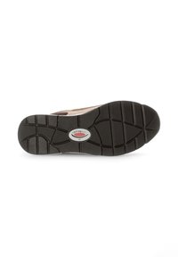 Black rubber shoe sole with textured tread, featuring a central logo, surrounded by light brown suede upper material.